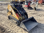 Used Mini Skid Steer in yard
